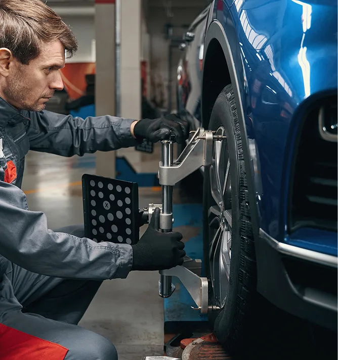 A person fixing 3d alignment wheel