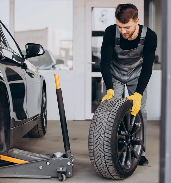 a person going to fit a tyre